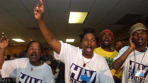 AIDS activists chant and dance 1 August 2003 in Durban, South Africa