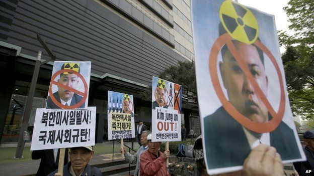 South Korean protesters hold pictures of North Korean leader Kim Jong Un during an anti-North Korea rally against recent missile launches and provocative acts, on the birthday of its founder, Kim Il Sung, in Seoul, South Korea, Tuesday, 15 April 2014