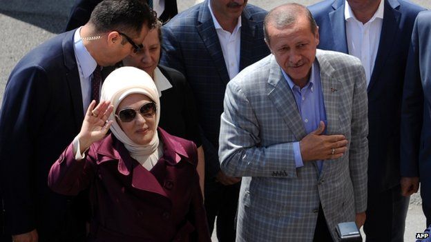 Turkish Prime Minister Recep Tayyip Erdogan (R) and his wife Emine (2nd L) on 10 August 2014