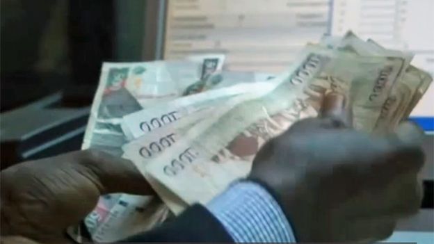 Someone counting money in Kenya