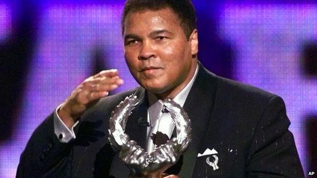 Boxing legend Muhammad Ali blows a kiss after receiving Sports Illustrateds 20th Century Sportsman of the Century Award in 1999