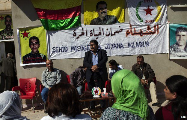 Salih Muslim, head of the Democratic Unity Party (PYD) receives condolences from Syrian Kurds after his son Servan was killed in fighting with jihadist militants (15 October 2013)