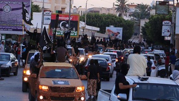 Islamic State militants parading through Derna
