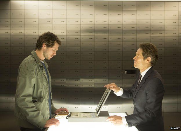 Grigory Dobrygin and Willem Dafoe in the bank vault in A Most Wanted Man