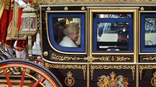 The Queen arrives for the State Opening of Parliament in 2013