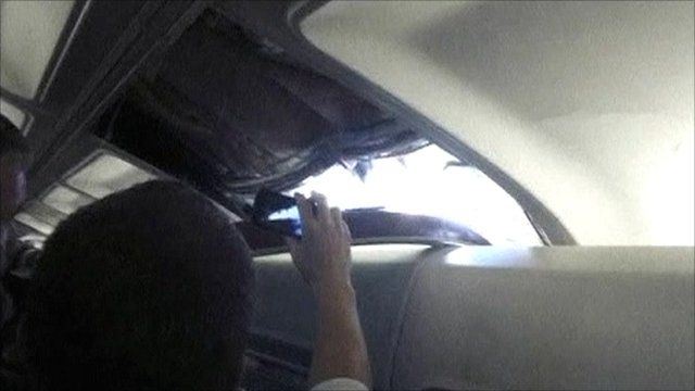 Passengers capture footage of the hole in the plane roof