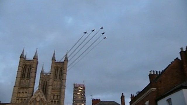 Five Red Arrows in formation above Lincoln cathedral