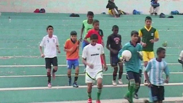 Boys playing football in Karachi