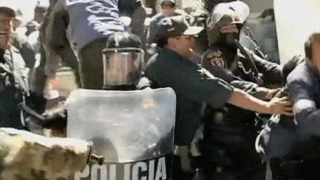 Demonstrators and police in Peru