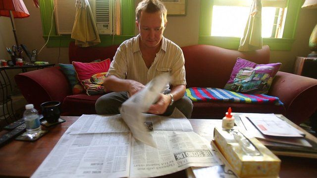 Man reading a newspaper