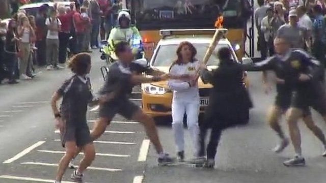 Officers tackle teenager as he tries to grab the Olympic torch in Gravesend, Kent