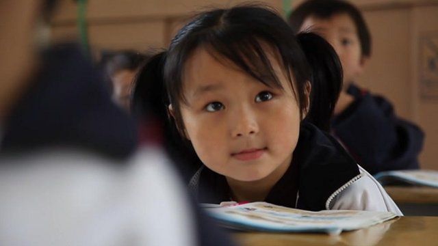 A Chinese classroom, where there are only two girls amongst twelve students