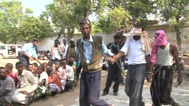 Militant suspects being taken away
