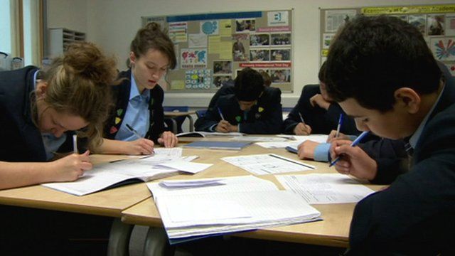 Children writing at desk