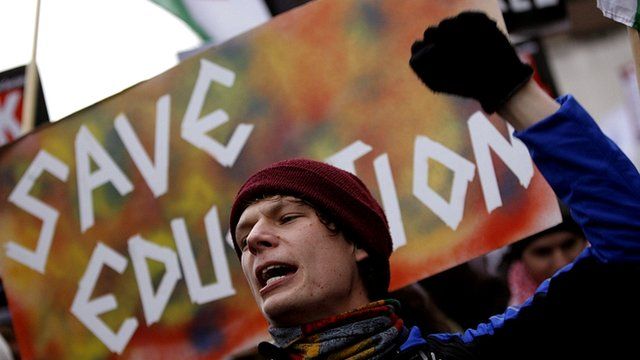 A protestor demonstrating against education cuts
