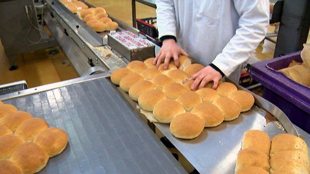 Bread rolls coming off the production line in a factory
