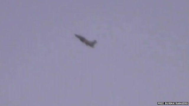 Burma military jet in sky over Kachin