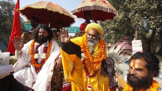 Sadhus, or Hindu holy men, arrive in a religious procession to participate in the Kumbh Mela