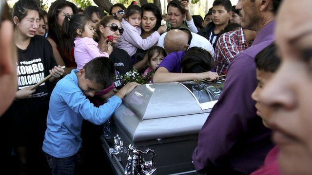 Mourners at band member's funeral