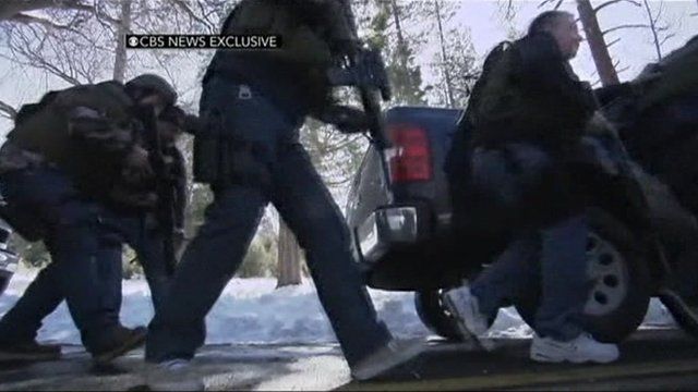 Armed police during gun battle