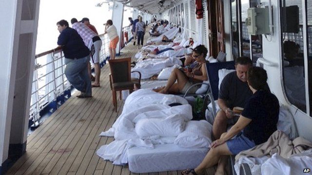 Passengers sleeping on the deck of the Carnival Cruise Ship