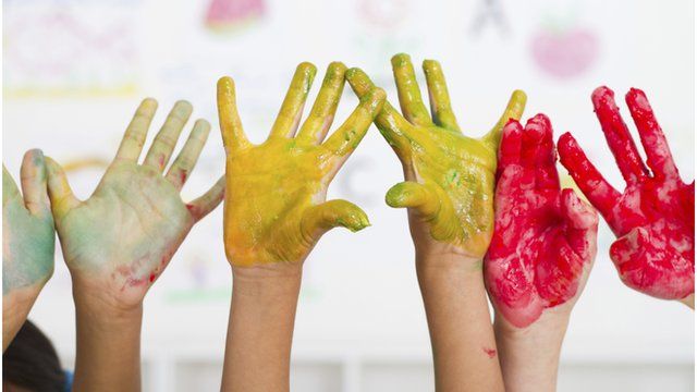Hands covered in paint
