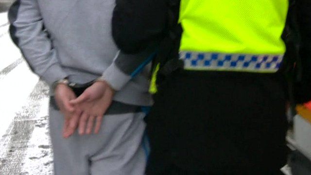 Suspect in handcuffs