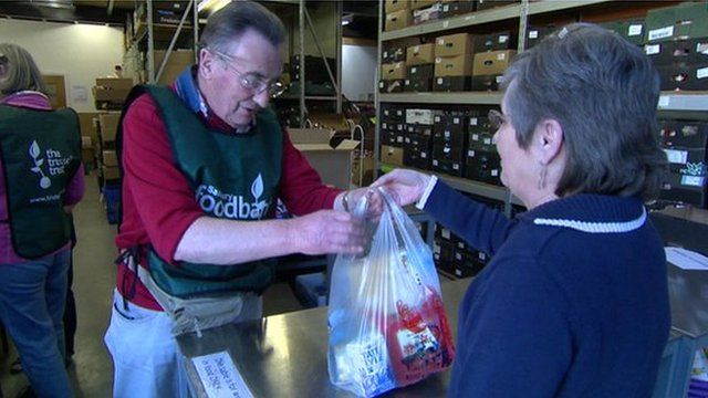 Woman donating to food bank
