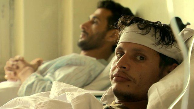 Men in hospital beds