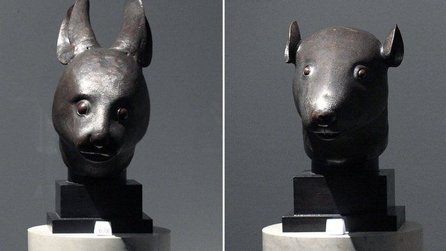 File photo: the bronze rat head statue (left) and rabbit head statue, 21 February 2009