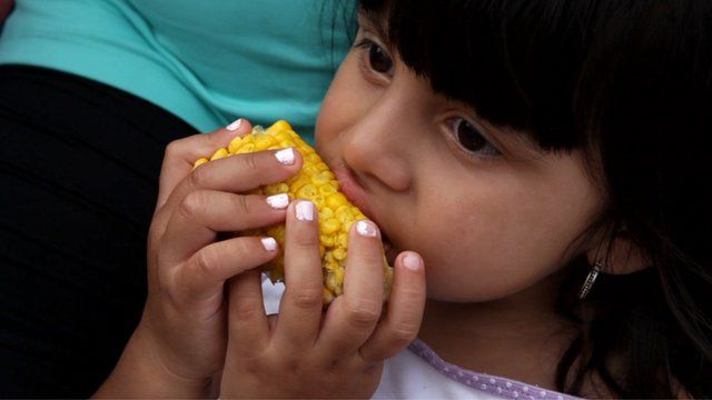 Eating corn on the cob at Coney Island