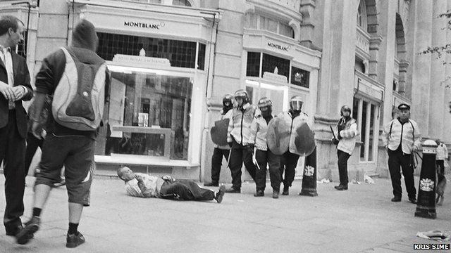 Ian Tomlinson lying on the ground (picture: Kris Sime)