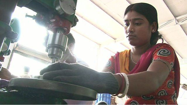 A factory worker in India