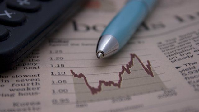 Financial papers, pen and calculator