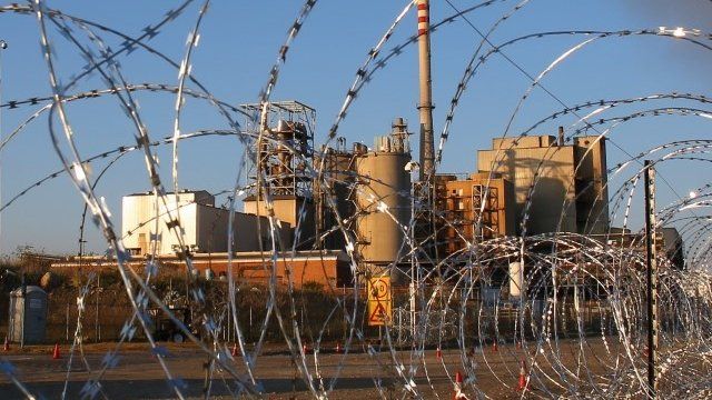 Barbed wire at the entrance to Lonmin's platinum mine in Marikana