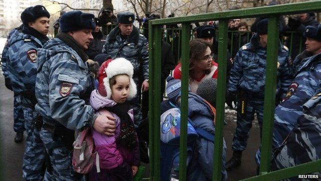 Children leave the school where the shooting incident took place