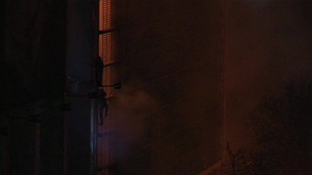 Protesters flee burning building