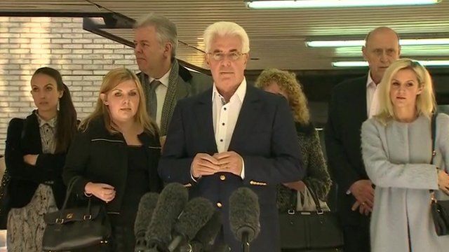 Max Clifford outside Southwark Crown Court surrounded by his family