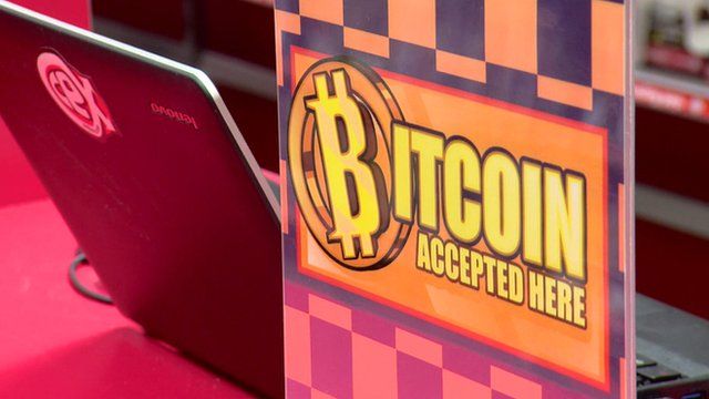 A 'bitcoin accepted here' sign