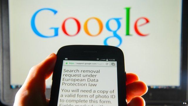 A Google search removal request displayed on the screen of a smart phone