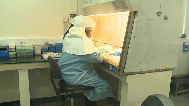 Woman performing tests in lab