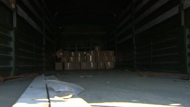 Interior of Russian aid truck, with a small pile of boxes at the back