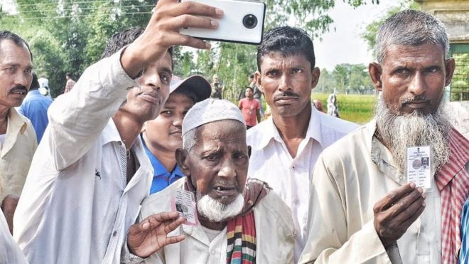 Asgar Ali, centre, is 103 years old and he became the oldest first-time voter from Moshaldanga area in Cooch Behar district on Thursday.