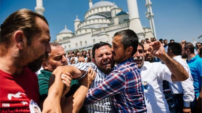 A man cries during the funeral ceremony of Sehidmiz Murat Inci, victim of the coup attempt, at Kocatepe Mosque in Ankara (July 18, 2016)