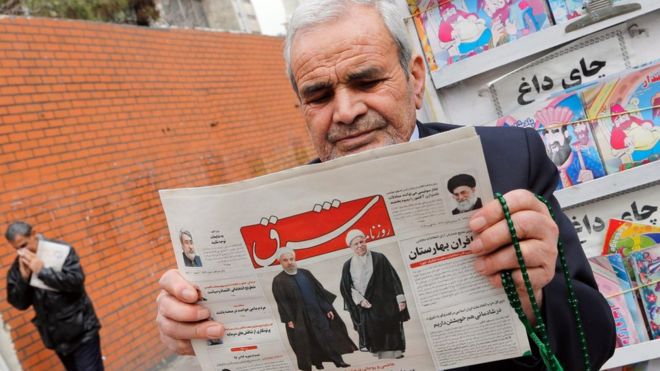 headline reading "Decisive victory for the reformist" outside a kiosk in Tehran, Iran, 28 February 2016