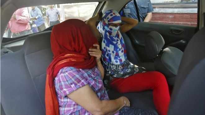 Two veiled Nepali women, who told police they were raped by a Saudi official, sit in a vehicle outside Nepal"s embassy in New Delhi, India, September 9, 2015.