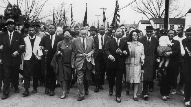 Martin Luther King and wife Coretta Scott King leading a black voting rights march