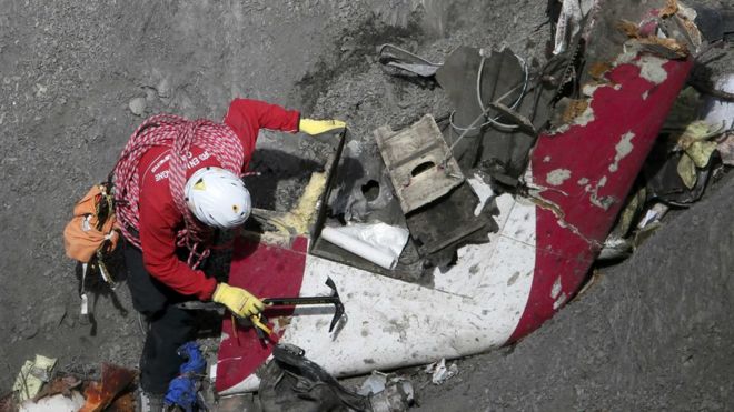 French rescue workers inspects debris from Flight 9525 - March 2015