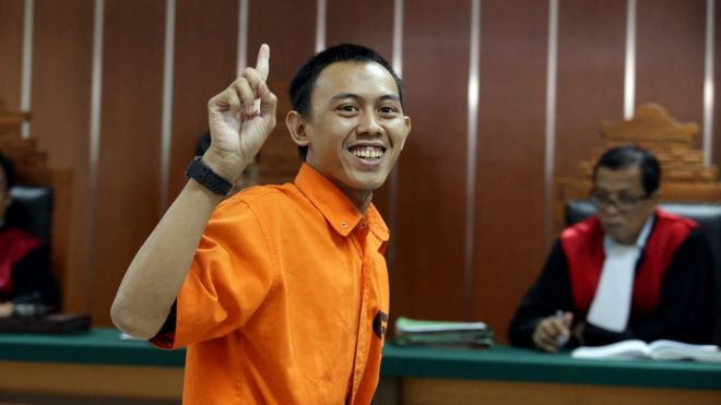 Indonesian militant Dodi Suridi, 23, smiles during his trial in Jakarta, Indonesia, 20 October 2016.