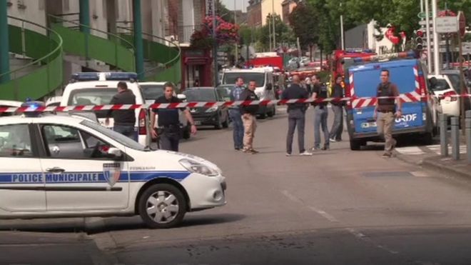 Police car and barricades on street in St Etienne du Rouvray in France - 26 July 2016